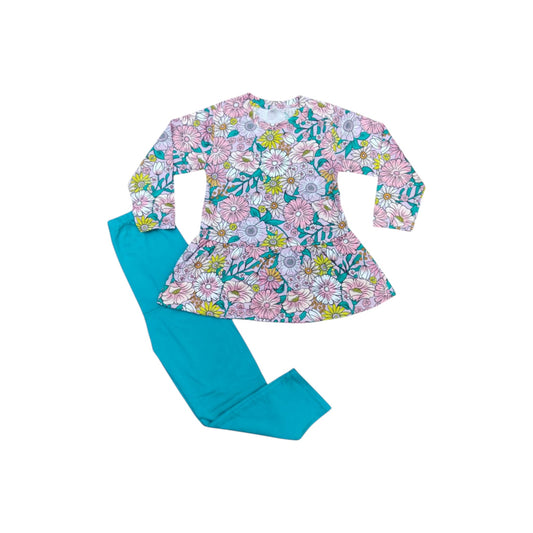 Floral top and blue leggings set on a white background