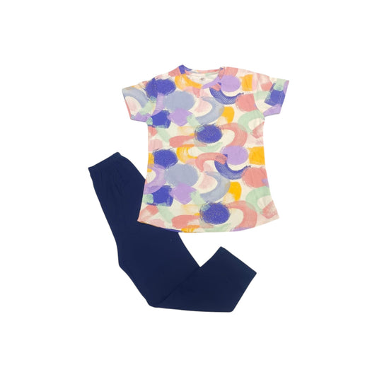 Colorful abstract-patterned top and navy pants on a white background