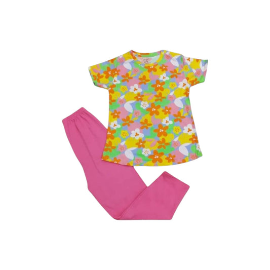Colorful floral top and pink pants on a white background