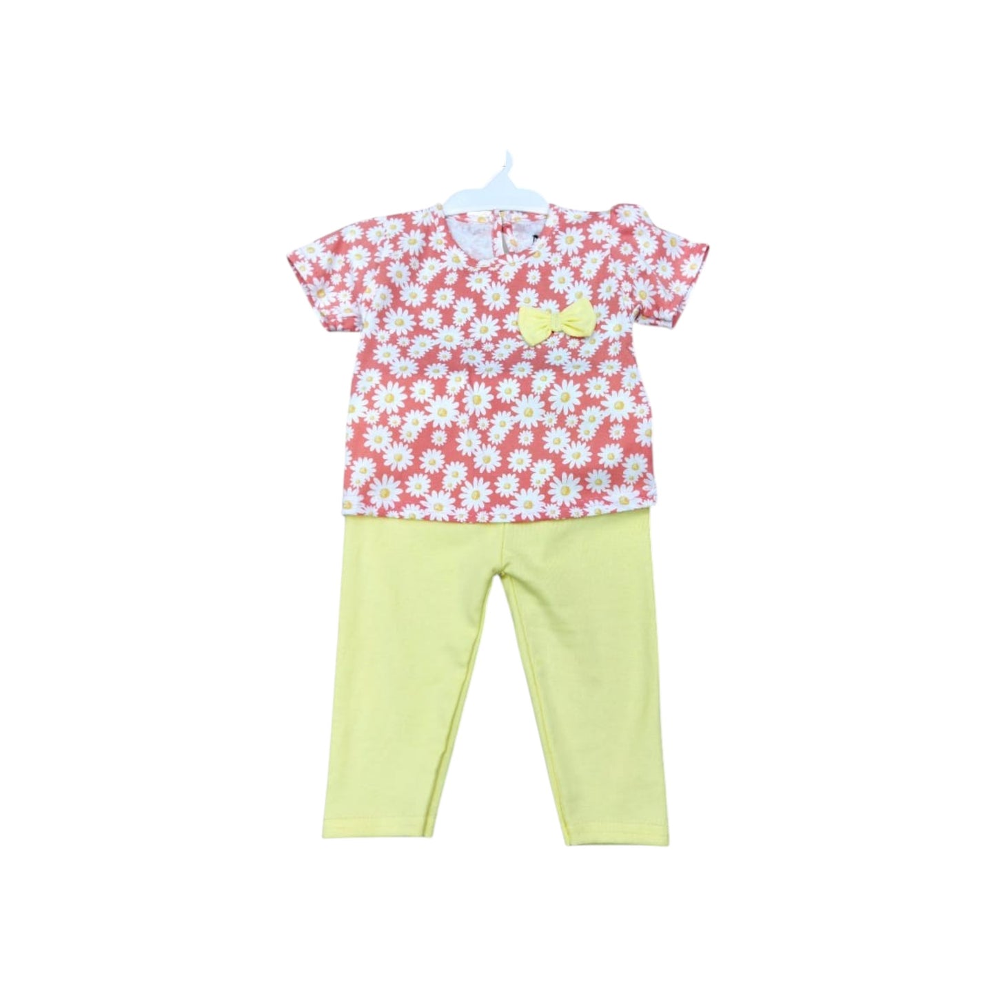 Children's outfit with floral top and yellow pants on a white background