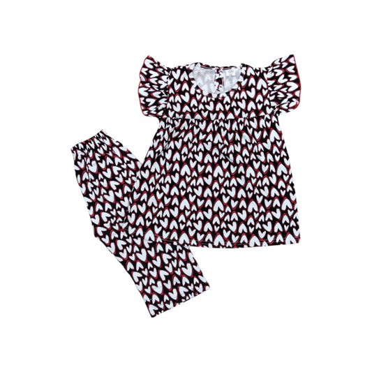 Set of top and pants with red and white pattern on a white background