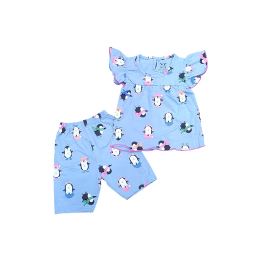 Children's pajama set with penguin pattern on a light blue background