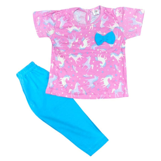 Pink shirt with unicorn pattern and blue pants on a white background