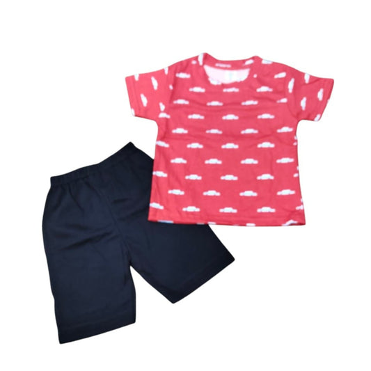 Pink t-shirt with white cloud pattern and black shorts on a white background