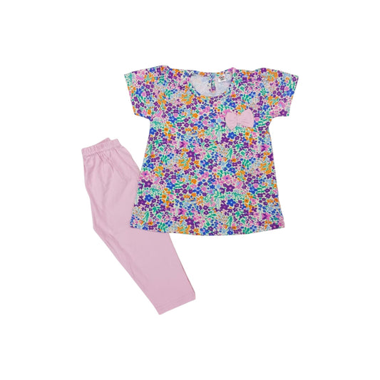 Children's pajama set with floral top and pink pants on a white background