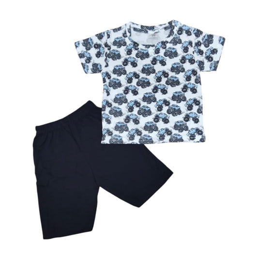 Children's outfit with a patterned t-shirt and black shorts on a white background