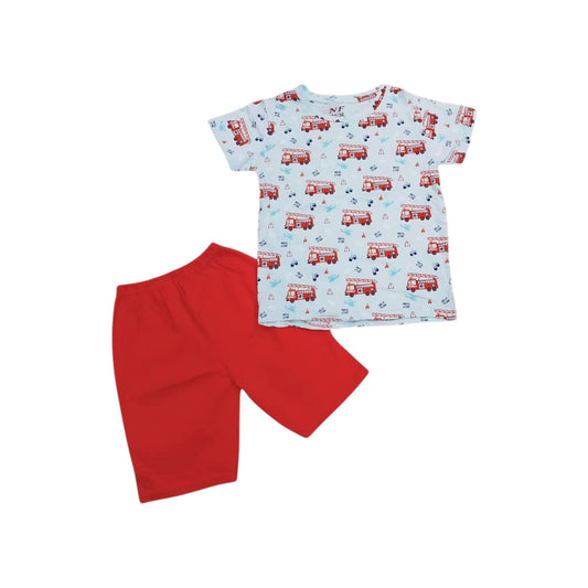 Children's outfit with a patterned shirt and red shorts on a white background
