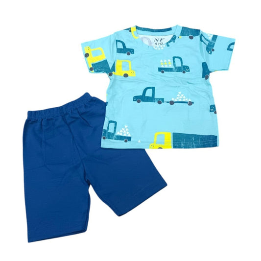 Children's outfit with blue shirt and shorts featuring truck patterns on a white background