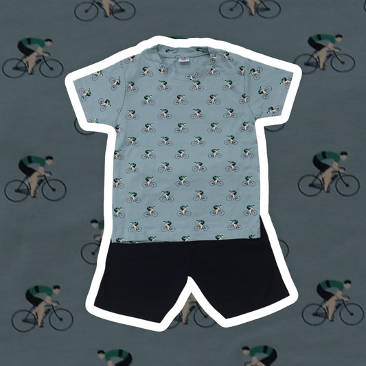 Light blue cycling jersey with black shorts on a background of cyclists.