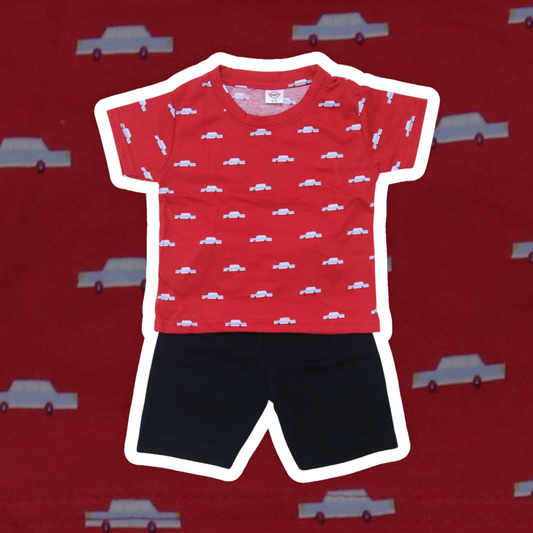 Red t-shirt with car pattern and black shorts on a red background with car illustrations.