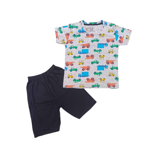 Children's t-shirt with vehicle pattern and black shorts on a white background
