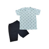 Children's outfit with a patterned shirt and black shorts on a white background