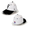 Two white baseball caps with black visors on a white background