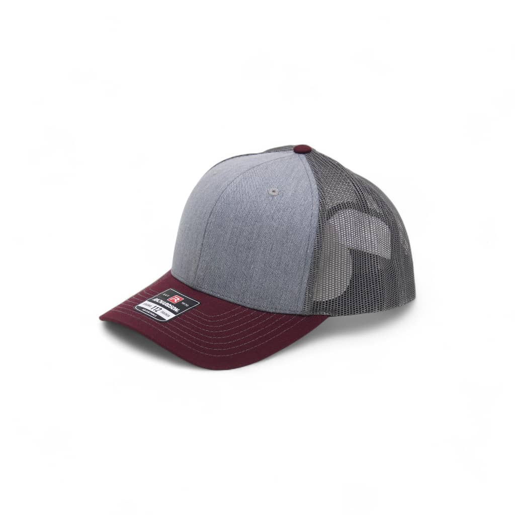 Gray and maroon baseball cap on a white background
